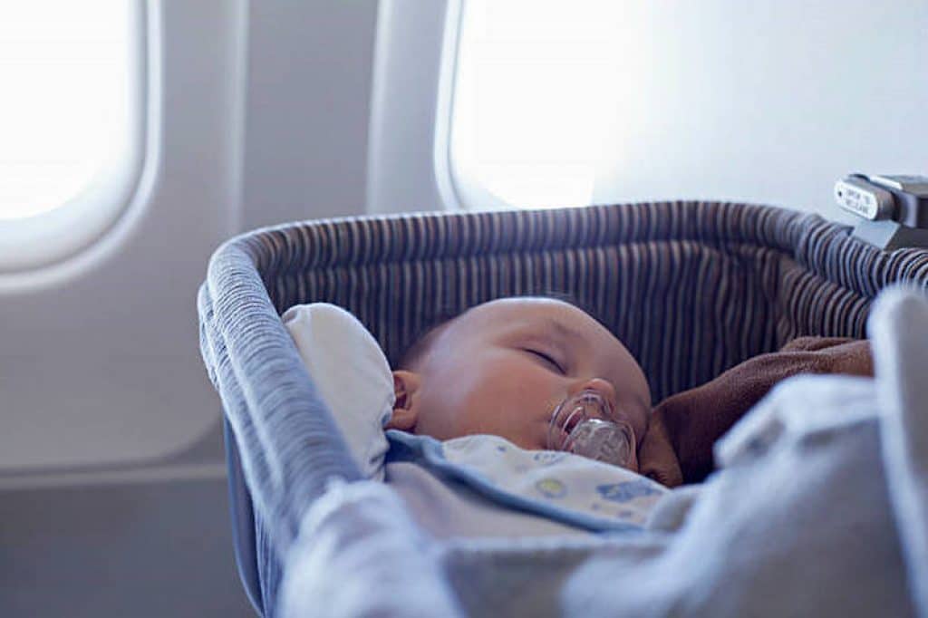 Baby Sleeping in portable traveller crib