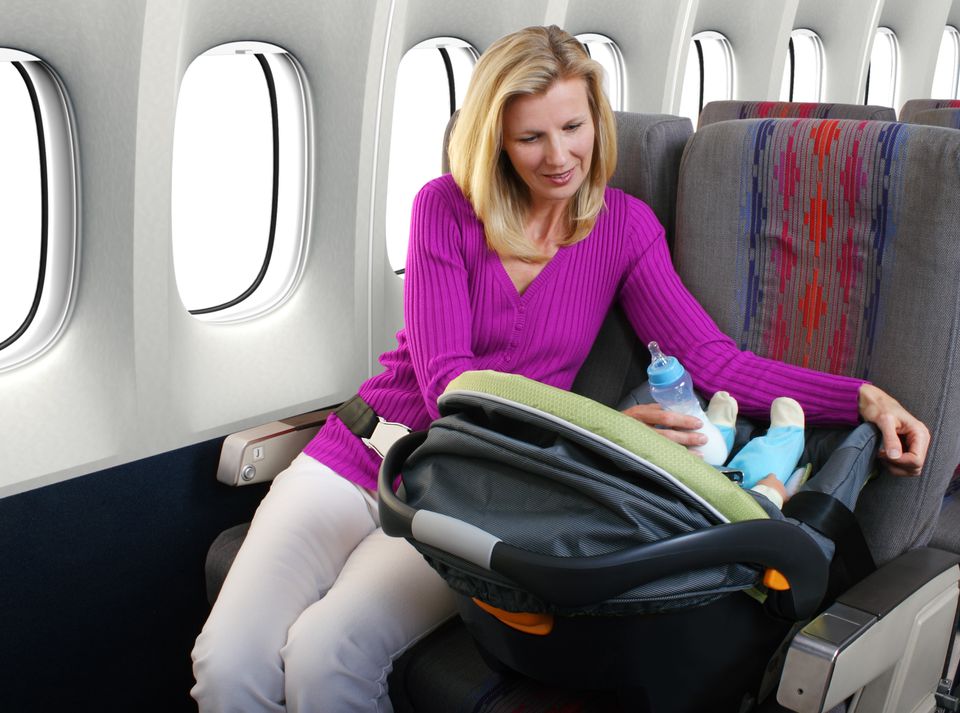 baby with extra seat on a plane