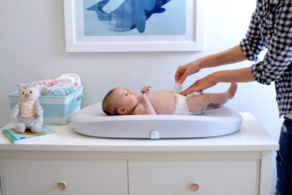 baby on changing table