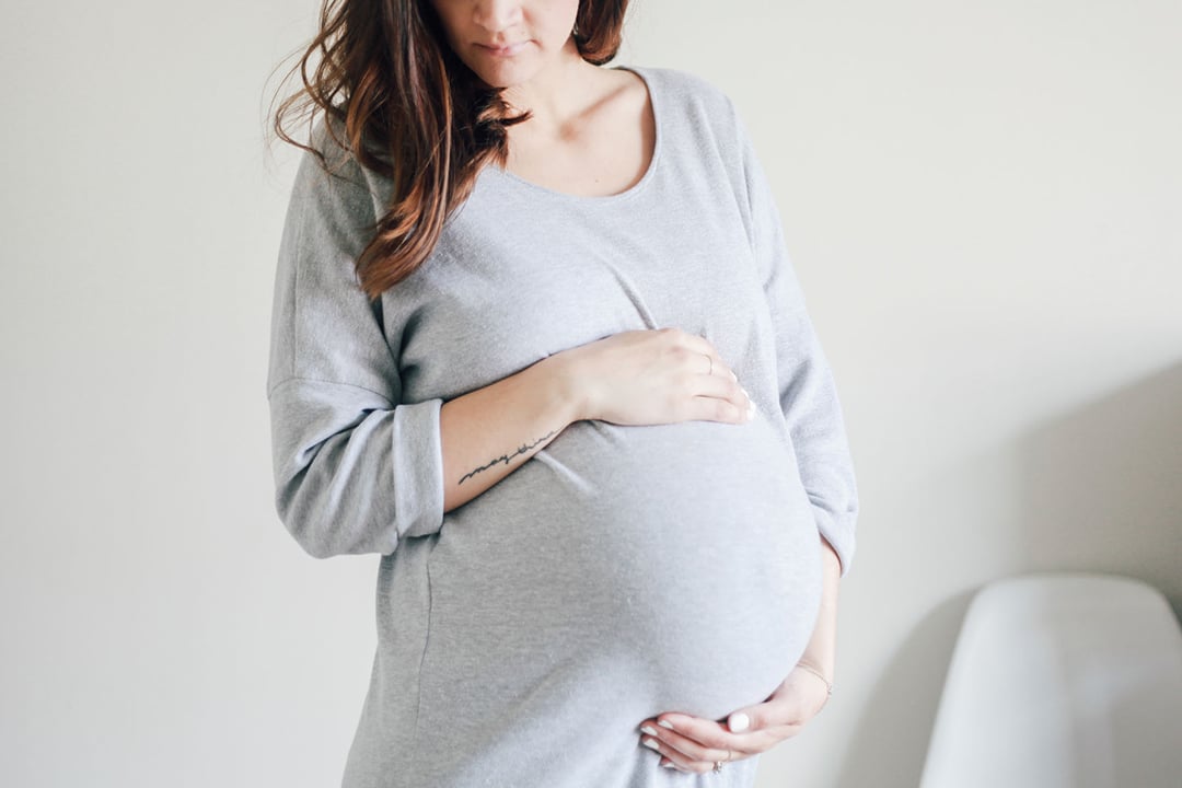 Pregnant Woman Holding Her Belly