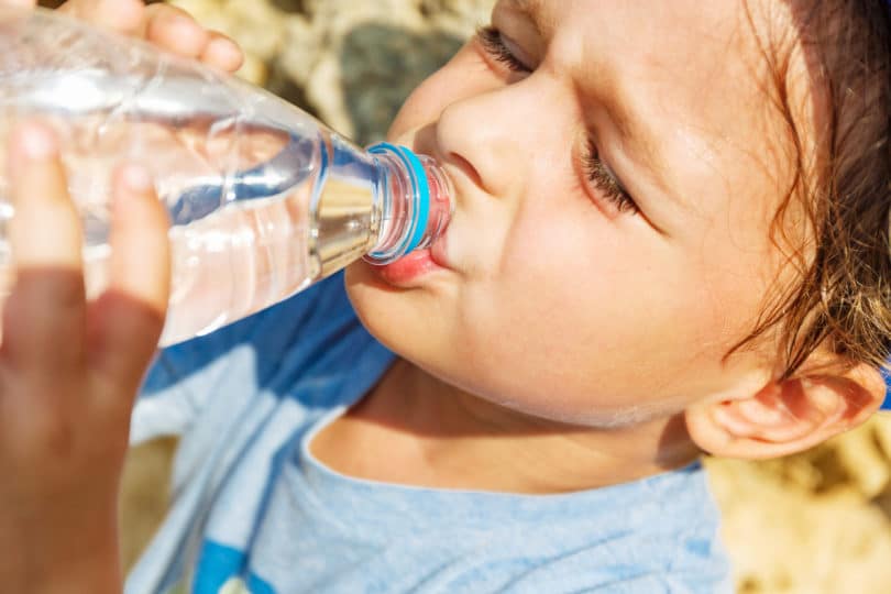 Little boy is drinking water