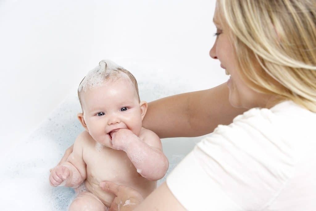 mom bathing baby